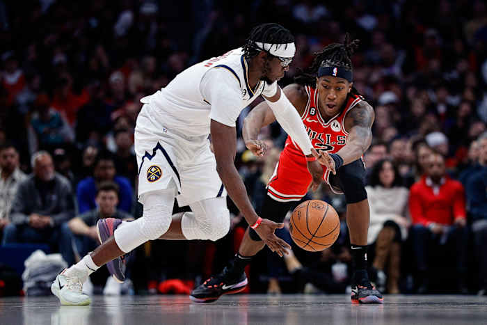 Mar 8, 2023; Denver, Colorado, USA; Denver Nuggets guard Reggie Jackson (7) controls the ball as Chicago Bulls guard Ayo Dosunmu (12) defends